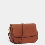brown leather sling bag on white background